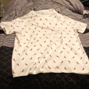 White shirt with red chili peppers